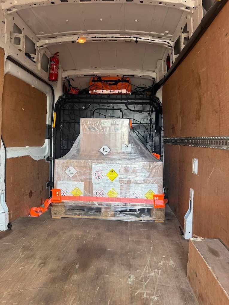 Placarded pallet of oxidiser and environmentally hazardous chemicals strapped inside a Purple B van