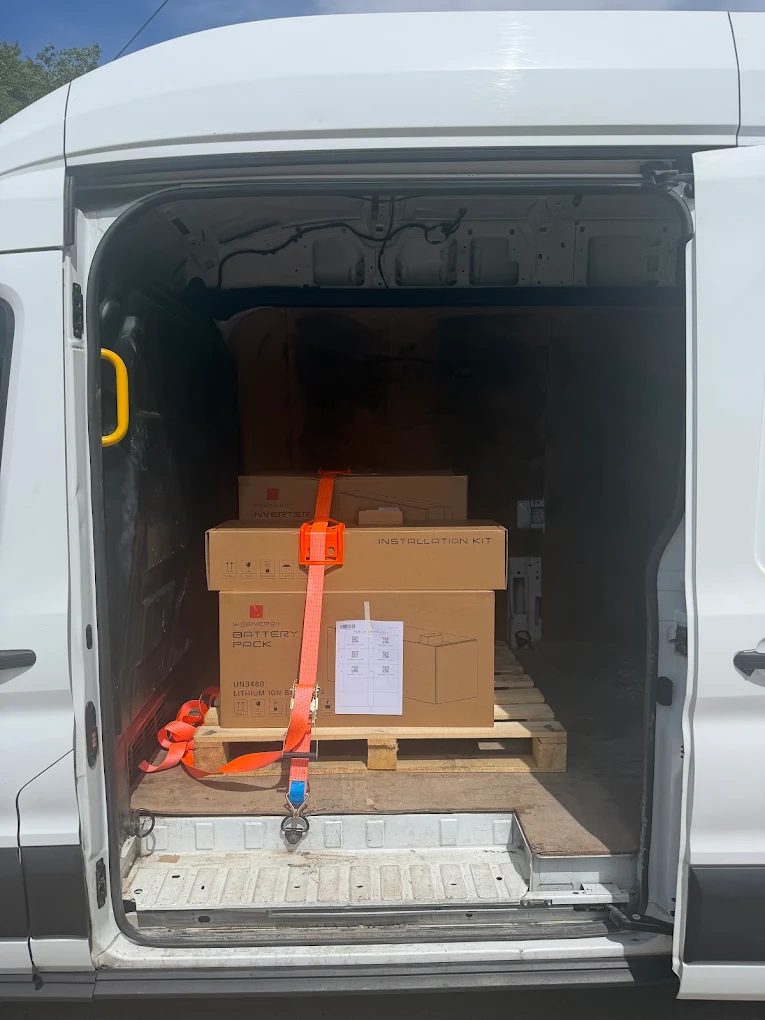 UN3480 lithium-ion battery pack and installation kit strapped in a Purple B van