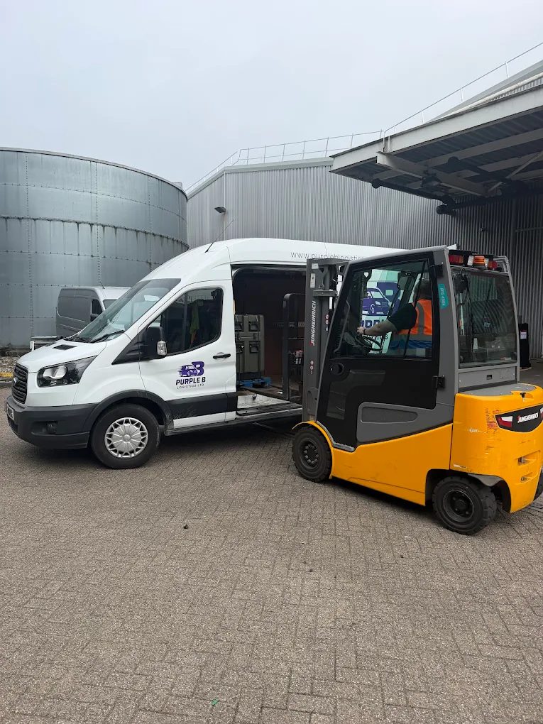 Purple B Logistics van being loaded by forklift at an industrial site